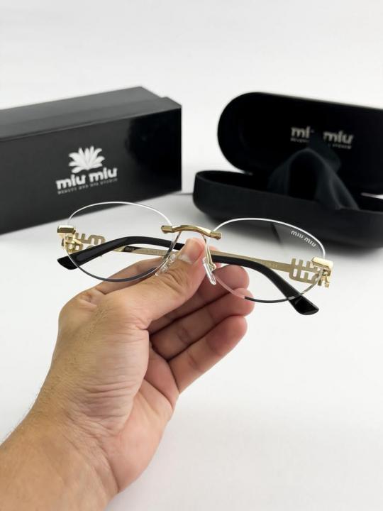MIU MIU gold frame 1025